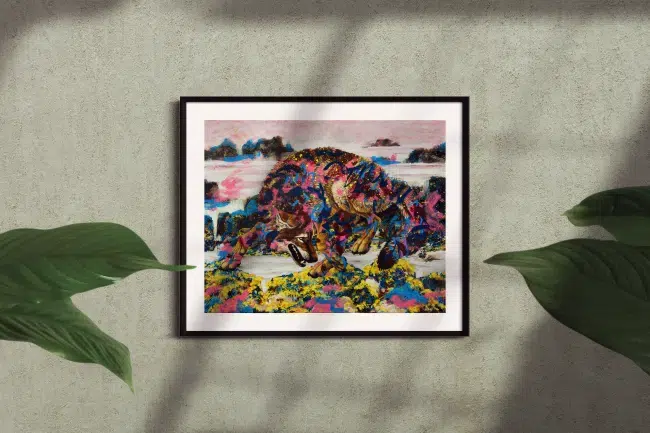 Coastal Wolf At Play-framed print mockup in room. A painting of a wolf playfully leaping over some seaweed covered rocks. The rocky coastline background is rendered loosly in an abstract style. The wolf is painted over with abstract elements in various colors.