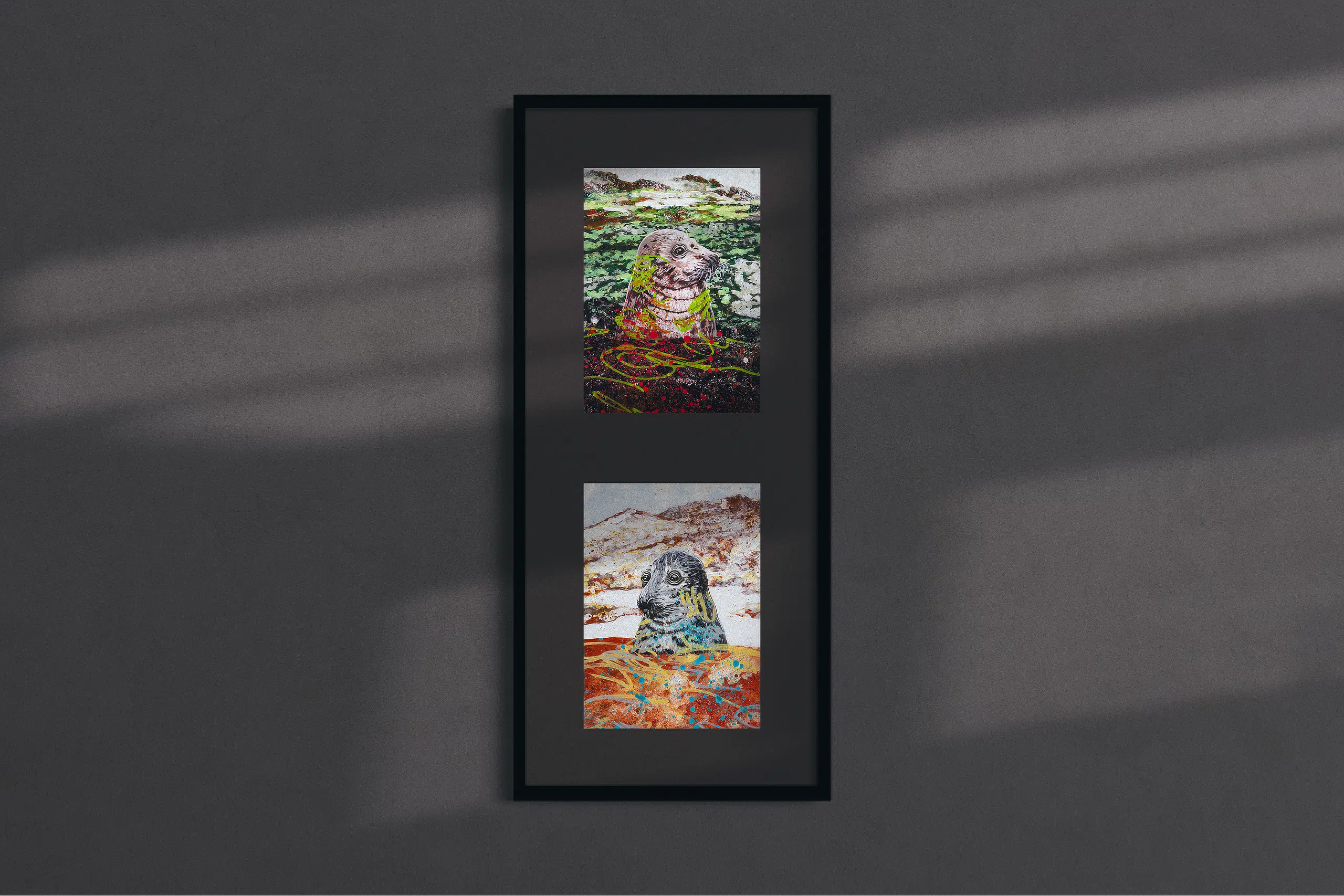 This Place Is Magic-framed vertical dyptich mockup in room. Painting of a gray seal portrait over a green landscape background inspired by Krafla Lava Feilds in Iceland and Painting of a gray seal portrain over a red landscape background inspired by Hverir Geothermal Area in Iceland.